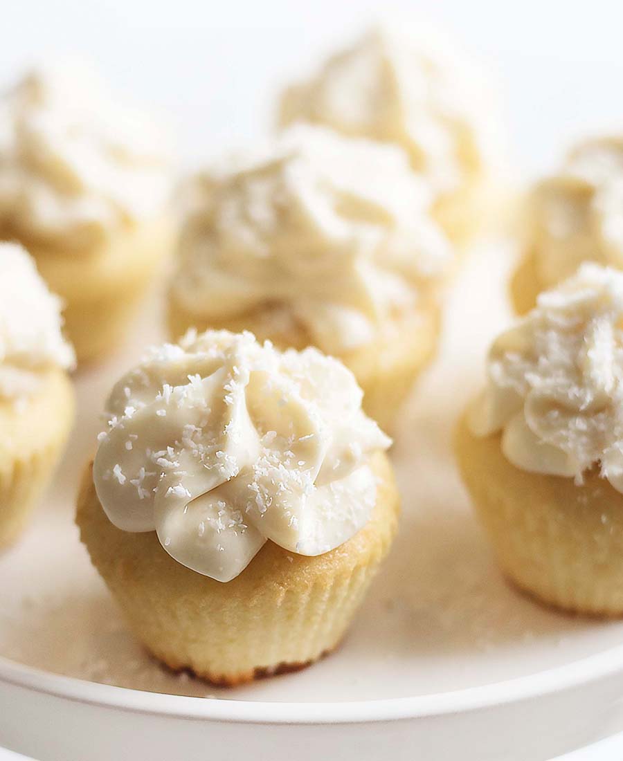 Don’t let these small, cupcakes fool you – they are packed with sweet flavors of vanilla and coconut! The icing is creamy, smooth, tasty, and a perfect topping to these light gluten-free cupcakes.